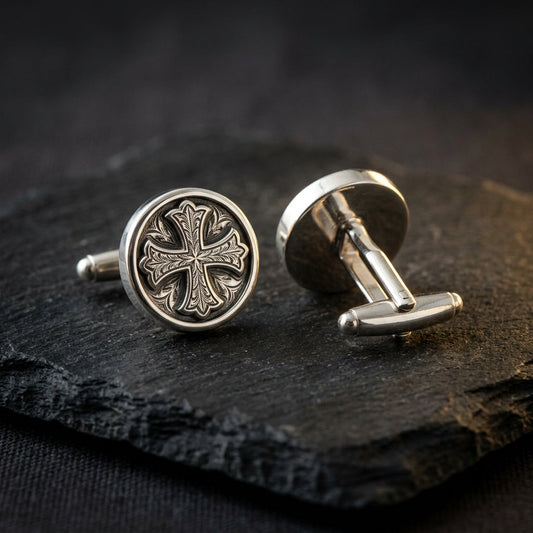 Luxury whale back cufflinks on dark slate with cross design showing closure mechanism